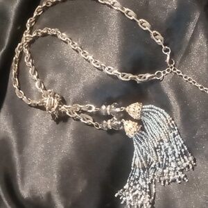 White house black market blue beaded tassel necklace blue leather laced chain.